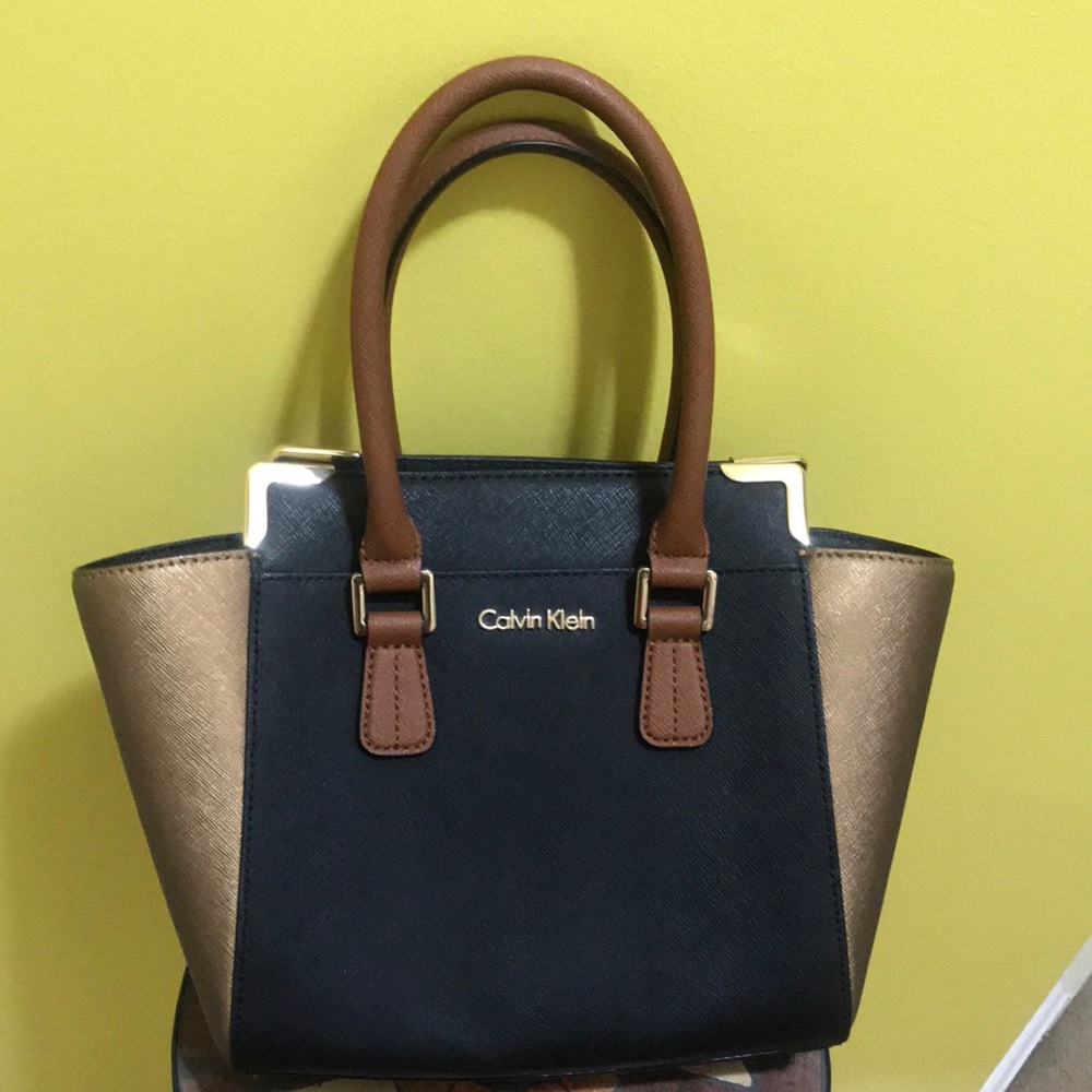 Pristine condition Calvin Klein small but not a mini
